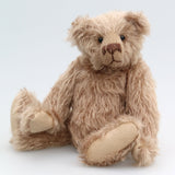 Buster is a very sweet and friendly, quite traditional, one of a kind, mohair artist teddy bear by Barbara Ann Bears, he stands 10 inches/25 cm tall and is 7.5 inches/19 cm sitting. Buster is made from beautiful, quite sparse, fairly straight, soft beige mohair, with German wool-felt paw pads and spherical, glass eyes