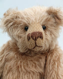 Buster is a very sweet and friendly, quite traditional, one of a kind, mohair artist teddy bear by Barbara Ann Bears, he stands 10 inches/25 cm tall and is 7.5 inches/19 cm sitting. Buster is made from beautiful, quite sparse, fairly straight, soft beige mohair, with German wool-felt paw pads and spherical, glass eyes