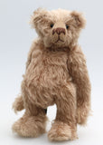 Buster is a very sweet and friendly, quite traditional, one of a kind, mohair artist teddy bear by Barbara Ann Bears, he stands 10 inches/25 cm tall and is 7.5 inches/19 cm sitting. Buster is made from beautiful, quite sparse, fairly straight, soft beige mohair, with German wool-felt paw pads and spherical, glass eyes