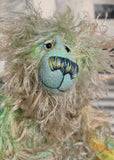Byron is a wild thing, yet a very friendly wild thing, a one of a kind, hand dyed mohair artist bear by Barbara-Ann Bears, he stands 10.5 inches (26 cm) tall and is 8 inches (20 cm) sitting. He is made from a gorgeous, long, straggly mohair that Barbara has dyed in jade, turquoise with some green, amber and sky blue