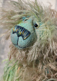 Byron is a wild thing, yet a very friendly wild thing, a one of a kind, hand dyed mohair artist bear by Barbara-Ann Bears, he stands 10.5 inches (26 cm) tall and is 8 inches (20 cm) sitting. He is made from a gorgeous, long, straggly mohair that Barbara has dyed in jade, turquoise with some green, amber and sky blue
