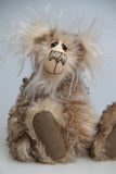 Calhoun is a charming and very friendly, one of a kind, artist bear by Barbara-Ann Bears in wonderfully fluffy tipped mohair and faux fur, he stands 11.5 inches(29 cm) tall and is 8.5 inches (21 cm) sitting.
