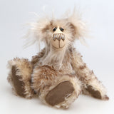 Calhoun is a charming and very friendly, one of a kind, artist bear by Barbara-Ann Bears in wonderfully fluffy tipped mohair and faux fur, he stands 11.5 inches(29 cm) tall and is 8.5 inches (21 cm) sitting.