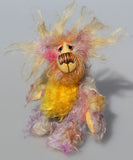 Cameron Chortles is a very happy teddy bear,he is quite colourful in a subdued way, a one of a kind, mohair artist bear by Barbara-Ann Bears Cameron Chortles is quite a little bear, he stands just 7 inches( 17 cm) tall and is 5 inches ( 13 cm) sitting, these measurements don't include his very fluffy ears which add another 2.5 inches (6cm).