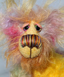 Cameron Chortles is a very happy teddy bear,he is quite colourful in a subdued way, a one of a kind, mohair artist bear by Barbara-Ann Bears Cameron Chortles is quite a little bear, he stands just 7 inches( 17 cm) tall and is 5 inches ( 13 cm) sitting, these measurements don't include his very fluffy ears which add another 2.5 inches (6cm).
