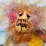 Cameron Chortles is a very happy teddy bear,he is quite colourful in a subdued way, a one of a kind, mohair artist bear by Barbara-Ann Bears Cameron Chortles is quite a little bear, he stands just 7 inches( 17 cm) tall and is 5 inches ( 13 cm) sitting, these measurements don't include his very fluffy ears which add another 2.5 inches (6cm).