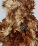 Carlyle is a very handsome and cuddly, beautifully coloured, one of a kind, teddy bear by Barbara-Ann Bears in wonderful batik mohair Carlyle stands 10 inches(25 cm) tall and is 7.5 inches (19 cm) sitting.  Carlyle is a very calm and relaxed teddy bear, he is made from the most gorgeous batik and fluffy mohairs