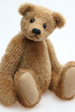 Cecil is a gorgeous little one of a kind traditional teddy bear made from beautiful antique gold mohair by Barbara Ann Bears. Cecil is 8 inches (20cm) tall and is 6 inches (15cm) sitting.
