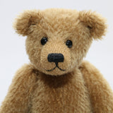 Cecil is a gorgeous little one of a kind traditional teddy bear made from beautiful antique gold mohair by Barbara Ann Bears. Cecil is 8 inches (20cm) tall and is 6 inches (15cm) sitting.