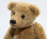 Cecil is a gorgeous little one of a kind traditional teddy bear made from beautiful antique gold mohair by Barbara Ann Bears. Cecil is 8 inches (20cm) tall and is 6 inches (15cm) sitting.