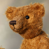 Charleston is a charming, traditional one of a kind artist bear in German mohair by Barbara Ann Bears, he stands 10 inches/27 cm tall and is 7.5 inches/22 cm sitting. Ambrose is made from wildly distressed, 'proper brown' German mohair, he has matching brown, wool-felt paw pads and vintage boot buttons for eyes
