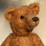 Charleston is a charming, traditional one of a kind artist bear in German mohair by Barbara Ann Bears, he stands 10 inches/27 cm tall and is 7.5 inches/22 cm sitting. Ambrose is made from wildly distressed, 'proper brown' German mohair, he has matching brown, wool-felt paw pads and vintage boot buttons for eyes