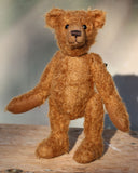 Charleston is a charming, traditional one of a kind artist bear in German mohair by Barbara Ann Bears, he stands 10 inches/27 cm tall and is 7.5 inches/22 cm sitting. Ambrose is made from wildly distressed, 'proper brown' German mohair, he has matching brown, wool-felt paw pads and vintage boot buttons for eyes