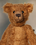 Charleston is a charming, traditional one of a kind artist bear in German mohair by Barbara Ann Bears, he stands 10 inches/27 cm tall and is 7.5 inches/22 cm sitting. Ambrose is made from wildly distressed, 'proper brown' German mohair, he has matching brown, wool-felt paw pads and vintage boot buttons for eyes