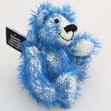 Charlie McCubbin is a very sweet and happy little blue mohair artist bear by Barbara Ann Bears, he stands just 5.5 inches( 14 cm) tall and is 4 inches (10 cm) sitting. Charlie McCubbin is made from a sparse, stringy blue mohair that has a pale, almost white, cotton backcloth, giving him a charmingly scruffy appearance