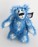 Charlie McCubbin is a very sweet and happy little blue mohair artist bear by Barbara Ann Bears, he stands just 5.5 inches( 14 cm) tall and is 4 inches (10 cm) sitting. Charlie McCubbin is made from a sparse, stringy blue mohair that has a pale, almost white, cotton backcloth, giving him a charmingly scruffy appearance