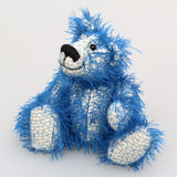 Charlie McCubbin is a very sweet and happy little blue mohair artist bear by Barbara Ann Bears, he stands just 5.5 inches( 14 cm) tall and is 4 inches (10 cm) sitting. Charlie McCubbin is made from a sparse, stringy blue mohair that has a pale, almost white, cotton backcloth, giving him a charmingly scruffy appearance