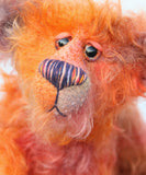 Chipotle is a wild and fiery, yet still very friendly, one of a kind artist bear in beautiful hand dyed mohair by Barbara-Ann Bears Chipotle stands 11 inches(28 cm) tall and is 8 inches (21 cm) sitting. Chipotle is a wild and shaggy chap, a bear who loves to walk across the hottest deserts, to be alone under the fiercest sun