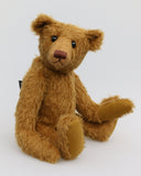 Cinnamon is an elegant and charming, one of a kind, traditional artist teddy bear by Barbara Ann Bears, he stands 15.5 inches/39cm tall and is 11 inches/28 cm sitting. Cinnamon is made from fairly sparse and wiry cinnamon coloured German mohair with matching German wool-felt paw pads and he has boot buttons for eyes,