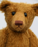 Cinnamon is an elegant and charming, one of a kind, traditional artist teddy bear by Barbara Ann Bears, he stands 15.5 inches/39cm tall and is 11 inches/28 cm sitting. Cinnamon is made from fairly sparse and wiry cinnamon coloured German mohair with matching German wool-felt paw pads and he has boot buttons for eyes,