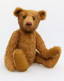 Cinnamon is an elegant and charming, one of a kind, traditional artist teddy bear by Barbara Ann Bears, he stands 15.5 inches/39cm tall and is 11 inches/28 cm sitting. Cinnamon is made from fairly sparse and wiry cinnamon coloured German mohair with matching German wool-felt paw pads and he has boot buttons for eyes,