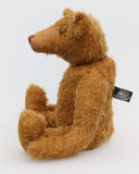 Cinnamon is the first of his design . He was designed to be proportioned like the very earliest teddy bears, with longer arms, a long snout and to be quite bear-like, not too cute but still very lovable.