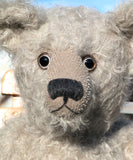 Clarence is an elegant yet cuddly, substantial, traditional one of a kind, artist teddy bear in gorgeous mohair by Barbara Ann Bears Hubert is 19 inches (48cm) tall and is 13.5 inches (35cm) sitting. Clarence is not the most classical in his proportions, he's more characterful with his long nose and neck and portly tummy, he's more distinguished and eccentric, a bear who has lived the good life