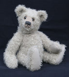 Clarence is an elegant yet cuddly, substantial, traditional one of a kind, artist teddy bear in gorgeous mohair by Barbara Ann Bears Hubert is 19 inches (48cm) tall and is 13.5 inches (35cm) sitting. Clarence is not the most classical in his proportions, he's more characterful with his long nose and neck and portly tummy, he's more distinguished and eccentric, a bear who has lived the good life