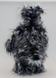 Clarence Clearwater is a magnificent, cuddly one of a kind, artist teddy bear in fabulous faux fur and gorgeous mohair by Barbara-Ann Bears, he stands 19 inches (48 cm) tall and is 14 inches (36 cm) sitting. Clarence is mostly made from a very long, exciting faux fur, mainly black with flashes of silver and grey