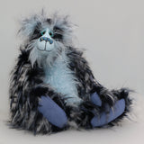Clarence Clearwater is a magnificent, cuddly one of a kind, artist teddy bear in fabulous faux fur and gorgeous mohair by Barbara-Ann Bears, he stands 19 inches (48 cm) tall and is 14 inches (36 cm) sitting. Clarence is mostly made from a very long, exciting faux fur, mainly black with flashes of silver and grey