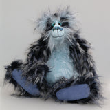 Clarence Clearwater is a magnificent, cuddly one of a kind, artist teddy bear in fabulous faux fur and gorgeous mohair by Barbara-Ann Bears, he stands 19 inches (48 cm) tall and is 14 inches (36 cm) sitting. Clarence is mostly made from a very long, exciting faux fur, mainly black with flashes of silver and grey