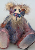 Clarence Sunbeam is a loveable and subtly coloured, one of a kind artist bear, in muted hand dyed mohair by Barbara-Ann Bears, he stands 8 inches/20 cm tall. Clarence Sunbeam is mostly made from a fairly short and sparse mohair hand dyed in indigo, lilac, mauve, rose and ultramarine with splashes of rusty amber.  His face is a very long, feathery pale beige mohair and the backs of his ears and the underside of his tail are a similarly coloured shorter, twirly mohair