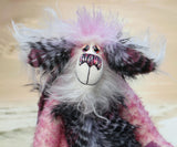 Clarissa The Candyfloss Mountain Dragon a wild yet calm and feminine fluffy pink dragon in gorgeous mohair and faux fur by Barbara Ann Bears, she stands 15 inches( 38 cm) tall and is 11.5 inches (29 cm) sitting. She is about 20 inches (50cm) from nose to tail and has a wingspan of 16 inches (40cm).