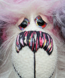 Clarissa The Candyfloss Mountain Dragon a wild yet calm and feminine fluffy pink dragon in gorgeous mohair and faux fur by Barbara Ann Bears, she stands 15 inches( 38 cm) tall and is 11.5 inches (29 cm) sitting. She is about 20 inches (50cm) from nose to tail and has a wingspan of 16 inches (40cm).