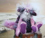Clarissa The Candyfloss Mountain Dragon a wild yet calm and feminine fluffy pink dragon in gorgeous mohair and faux fur by Barbara Ann Bears, she stands 15 inches( 38 cm) tall and is 11.5 inches (29 cm) sitting. She is about 20 inches (50cm) from nose to tail and has a wingspan of 16 inches (40cm).