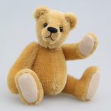 Cookie is a sweet and gentle, one of a kind, traditional artist teddy bear made from beautiful German mohair, by Barbara-Ann Bears. He stands 7 inches (18cm) tall and is 5 inches (13cm) sitting. Cookie is a sweet and charming, one of a kind, teddy bear. He's quite a traditional bear, with his beautiful blond mohair and his glass eyes, he's a gente chap a dreamer and a thinker and a dreamer. He is made from dense, short, honey gold German mohair