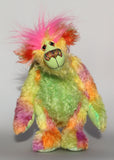Cora B.Limey is wildly colourful and happy, one of a kind, hand dyed mohair, artist bear by Barbara-Ann Bears, a bear of tropical exuberance Cora B.Limey stands 14.5 inches( 37 cm) tall and is 11.5 inches (29 cm) sitting, this doesn't include her shock of hair which adds another 3 inches (7.5 cm) to those figures.