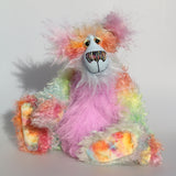 Cosmo is a gorgeous and gloriously colourful one of a kind artist bear in stunning hand dyed mohair and faux fur by Barbara-Ann Bears, she stands 16.5 inches( 42 cm) tall and is 12 inches ( 30 cm) sitting. Cosmo is mostly made from a long, wild mohair in colourful bands of blue, green, orange, gold, magenta and lime