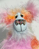 Cosmo is a gorgeous and gloriously colourful one of a kind artist bear in stunning hand dyed mohair and faux fur by Barbara-Ann Bears, she stands 16.5 inches( 42 cm) tall and is 12 inches ( 30 cm) sitting. Cosmo is mostly made from a long, wild mohair in colourful bands of blue, green, orange, gold, magenta and lime