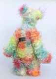 Cosmo is a gorgeous and gloriously colourful one of a kind artist bear in stunning hand dyed mohair and faux fur by Barbara-Ann Bears, she stands 16.5 inches( 42 cm) tall and is 12 inches ( 30 cm) sitting. Cosmo is mostly made from a long, wild mohair in colourful bands of blue, green, orange, gold, magenta and lime