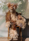 Crackerjack is a magnificent, charming and elegant, one of a kind, artist bear by Barbara-Ann Bears in luxurious hand-dyed fluffy mohair. He's 25 inches(64 cm) tall from his toes to his head and is 18 inches(46 cm) sitting from his bottom to his head, he has flexible knees and bent legs so he sits rather elegantly.