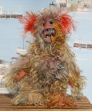 Cromarty is a wild, scraggly, scruffy bear, a one of a kind artist teddy bear in beautiful hand dyed mohair by Barbara-Ann Bears Cromarty stands 8.5 inches(24 cm) tall and is 7 inches (18 cm) sitting. Cromarty is a wild and shaggy chap, like a bearded collie he finds it very hard to keep the fur out of his eyes