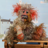 Cromarty is a wild, scraggly, scruffy bear, a one of a kind artist teddy bear in beautiful hand dyed mohair by Barbara-Ann Bears Cromarty stands 8.5 inches(24 cm) tall and is 7 inches (18 cm) sitting. Cromarty is a wild and shaggy chap, like a bearded collie he finds it very hard to keep the fur out of his eyes