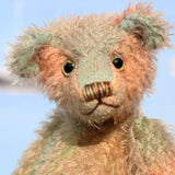 Cyril is a very handsome & subtly colourful, traditional, one of a kind artist teddy bear, in hand dyed mohair by Barbara Ann Bears, he stands 8.5 inches (21 cm) tall and is 6 inches (15 cm) sitting. Cyril is made from a fairly short and sparse German mohair hand-dyed in natural hues of jade, turquoise and a soft peach