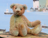 Cyril is a very handsome & subtly colourful, traditional, one of a kind artist teddy bear, in hand dyed mohair by Barbara Ann Bears, he stands 8.5 inches (21 cm) tall and is 6 inches (15 cm) sitting. Cyril is made from a fairly short and sparse German mohair hand-dyed in natural hues of jade, turquoise and a soft peach