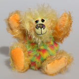Daffy Doolittle is a very happy and colourful one of a kind, hand dyed mohair and faux fur artist bear by Barbara-Ann Bears, she is 8.5 inches/21 cm tall. Daffy Doolittle is mostly a very curly and fairly mohair that Barbara has hand dyed in beautiful shades of yellow, green, lime and orange, with colourful faux fur.