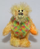Daffy Doolittle is a very happy and colourful one of a kind, hand dyed mohair and faux fur artist bear by Barbara-Ann Bears, she is 8.5 inches/21 cm tall. Daffy Doolittle is mostly a very curly and fairly mohair that Barbara has hand dyed in beautiful shades of yellow, green, lime and orange, with colourful faux fur.