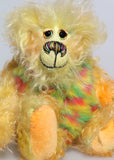 Daffy Doolittle is a very happy and colourful one of a kind, hand dyed mohair and faux fur artist bear by Barbara-Ann Bears, she is 8.5 inches/21 cm tall. Daffy Doolittle is mostly a very curly and fairly mohair that Barbara has hand dyed in beautiful shades of yellow, green, lime and orange, with colourful faux fur.
