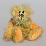 Daffy Doolittle is a very happy and colourful one of a kind, hand dyed mohair and faux fur artist bear by Barbara-Ann Bears, she is 8.5 inches/21 cm tall. Daffy Doolittle is mostly a very curly and fairly mohair that Barbara has hand dyed in beautiful shades of yellow, green, lime and orange, with colourful faux fur.