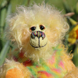 Daffy Doolittle is mostly a very curly and fairly mohair that Barbara has hand dyed in beautiful shades of yellow, green, lime and orange, with colourful faux fur.  Daffy Doolittle has beautiful, hand painted eyes with hand coloured eyelids, a splendid nose embroidered from individual threads to compliment her colouring and she has a huge, friendly smile